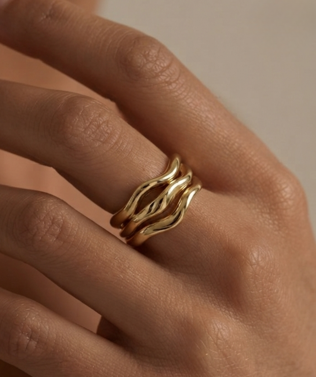 Golden molten ring on women's hand