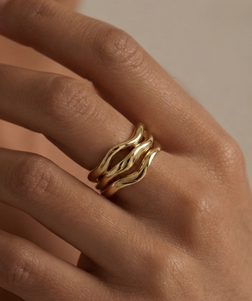 Golden molten ring on women's hand